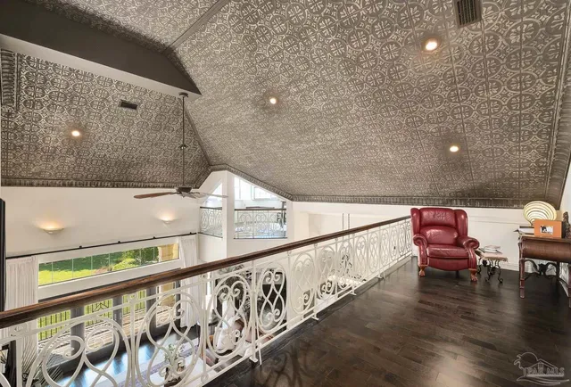 a view of a balcony with wooden floor