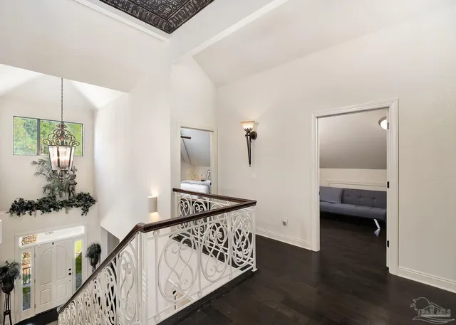 a living room with furniture and large windows