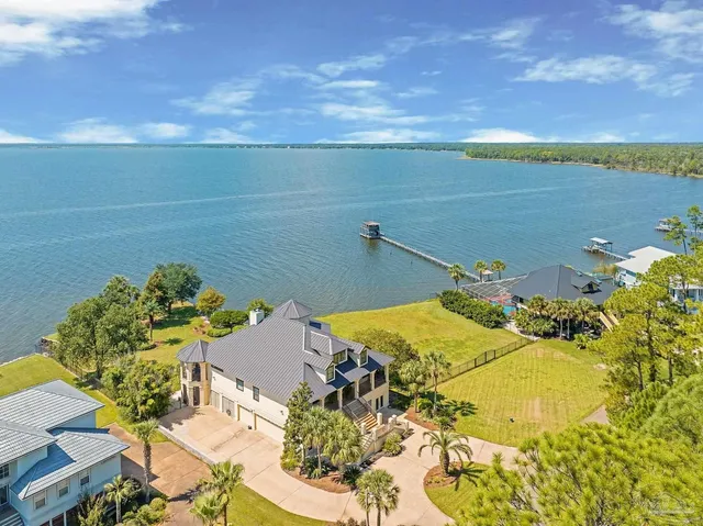a living room with furniture a rug and a painting on the wall