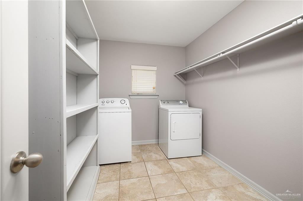 424 Frost Proof Drive Weslaco, TX 78599 - Photo 11 of 21 a utility room with dryer and washer