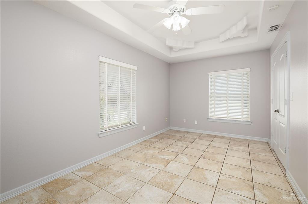 424 Frost Proof Drive Weslaco, TX 78599 - Photo 14 of 21 a view of an empty room with a window