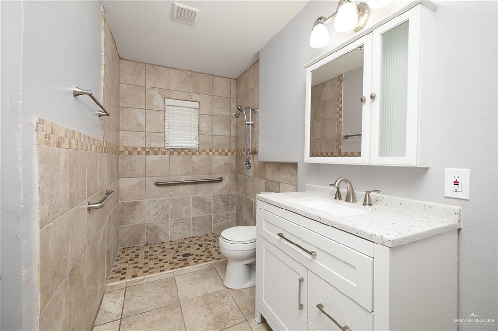 424 Frost Proof Drive Weslaco, TX 78599 - Photo 15 of 21 a bathroom with a sink toilet and shower
