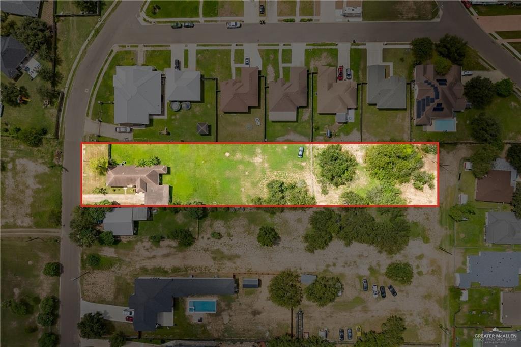 424 Frost Proof Drive Weslaco, TX 78599 - Photo 18 of 21 an aerial view of a house with a yard and a large tree