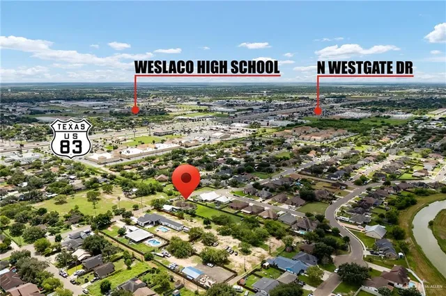 a sign that is sitting in front of flowers