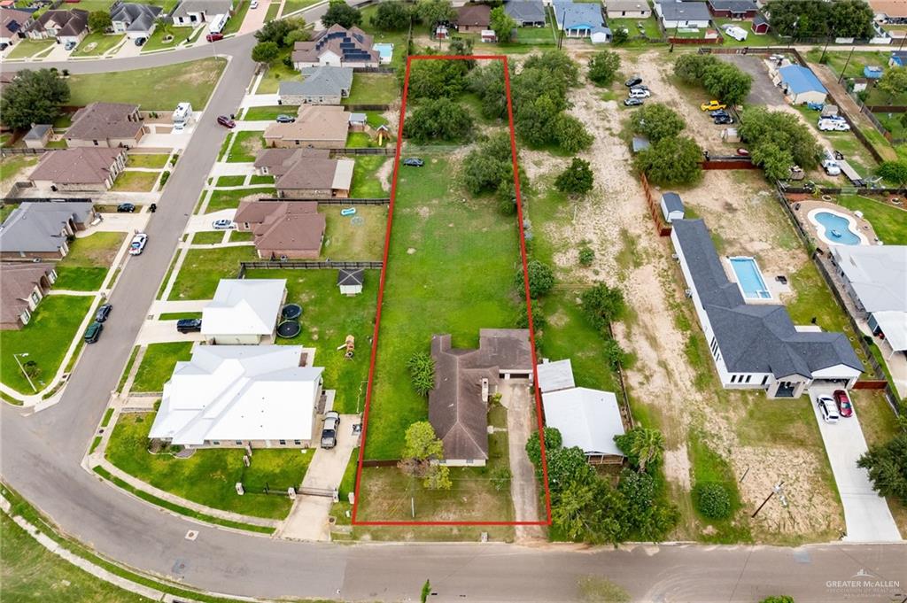 424 Frost Proof Drive Weslaco, TX 78599 - Photo 2 of 21 an aerial view of residential houses with outdoor space