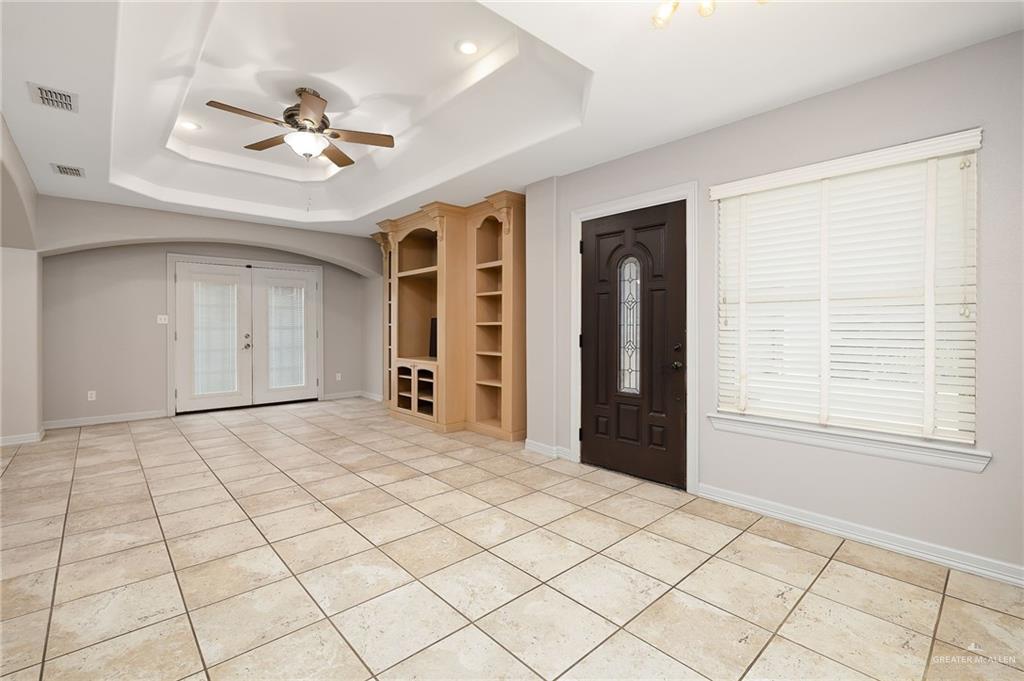 424 Frost Proof Drive Weslaco, TX 78599 - Photo 5 of 21 a view of an empty room with window and cabinet
