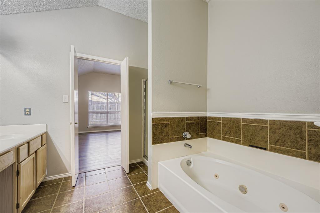 1118 Colbert Lane Duncanville, TX 75137 - Photo 11 of 17 a bathroom with a bathtub and shower