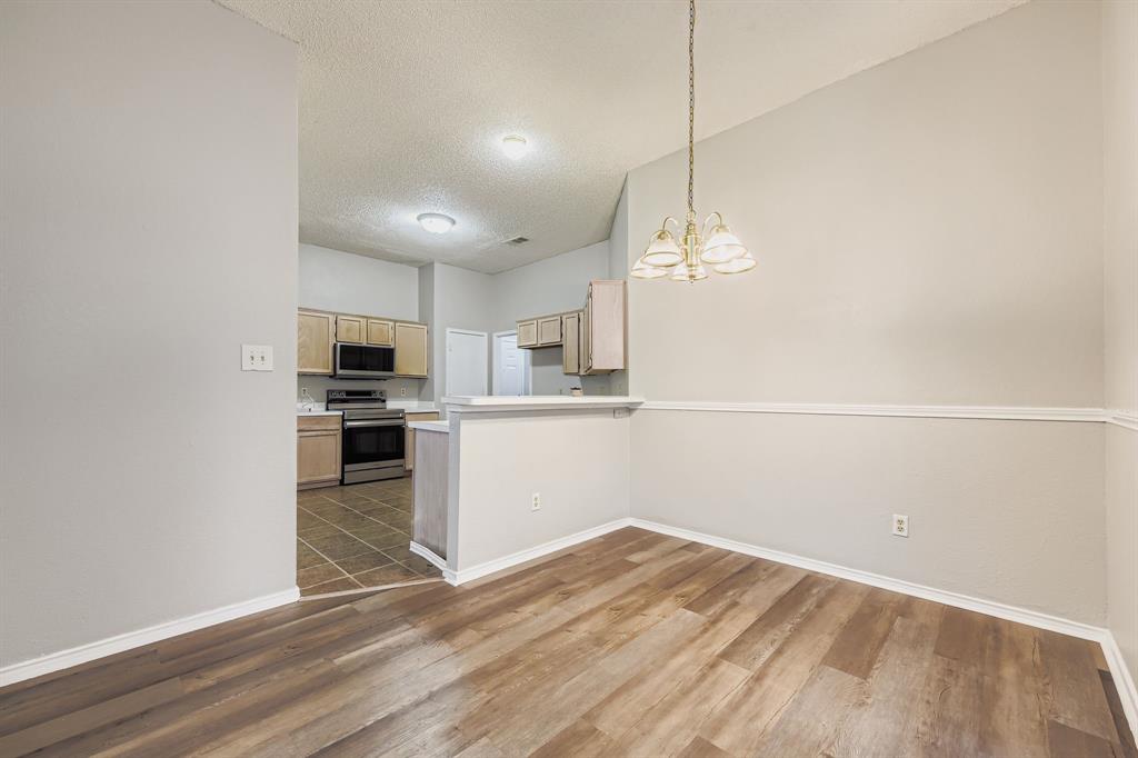 1118 Colbert Lane Duncanville, TX 75137 - Photo 5 of 17 a view of a kitchen with microwave and cabinets