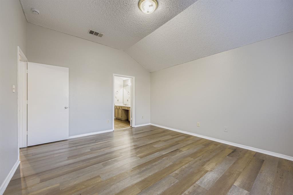 1118 Colbert Lane Duncanville, TX 75137 - Photo 10 of 17 a view of an empty room with wooden floor