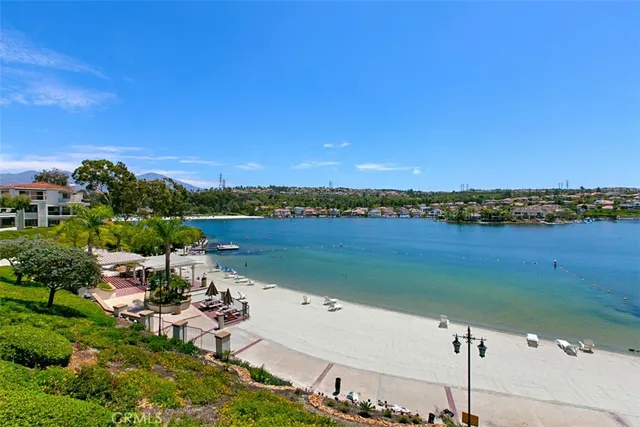 a view of a lake with couches and city view