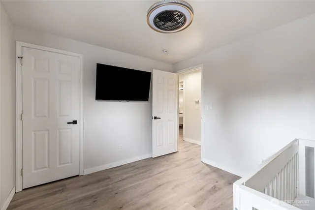 a view of a livingroom with wooden floor