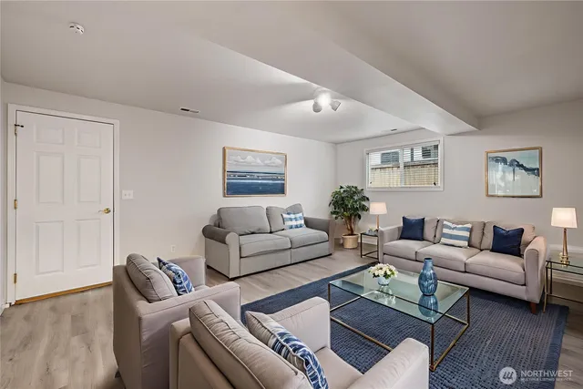 a living room with furniture and a window