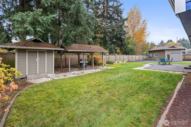 a front view of a house with a yard table and chairs