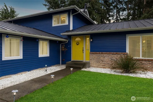 a front view of a house with garden