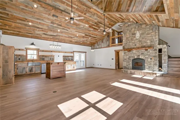 a living room with furniture and fireplace
