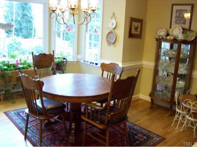 109 Brandywine Drive Raleigh, NC 27607 - Photo 3 of 11 Breakfast area with bay window that overlooks large fenced backyard