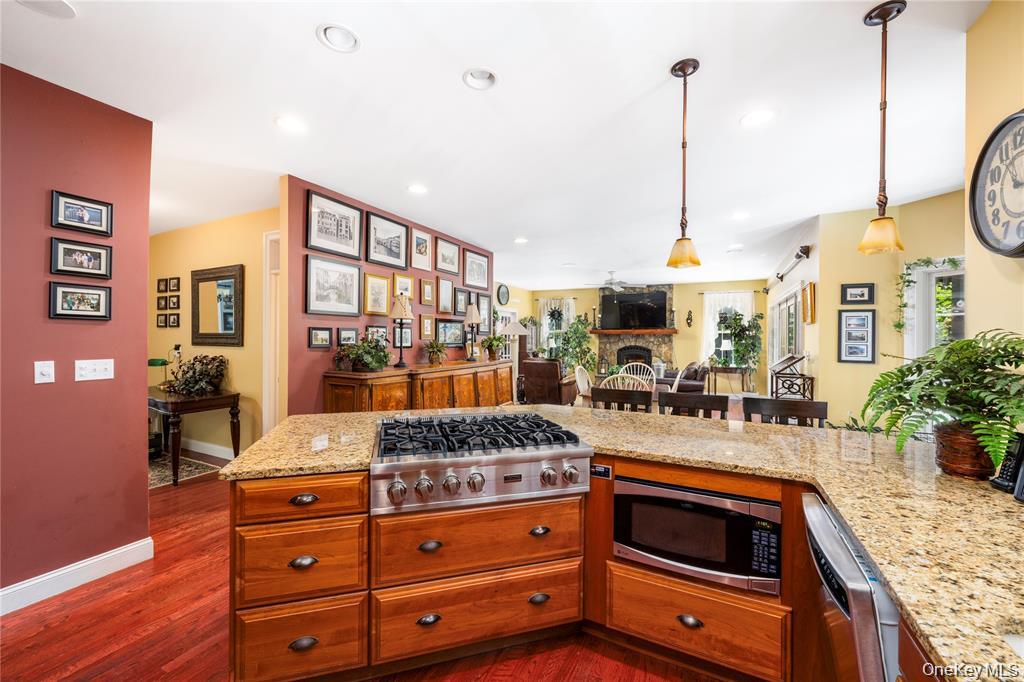 6 Old Town Road Beacon, NY 12508 - Photo 12 of 49 a kitchen with stainless steel appliances granite countertop a stove a sink and a wooden floors