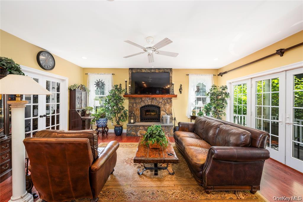 6 Old Town Road Beacon, NY 12508 - Photo 15 of 49 a living room with furniture a fireplace and a flat screen tv