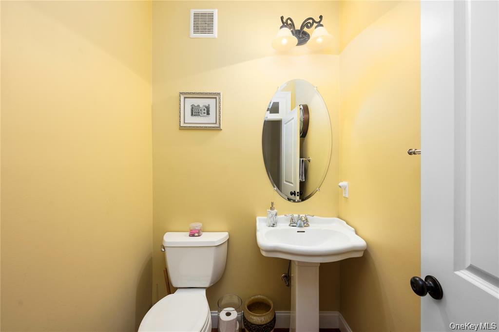 6 Old Town Road Beacon, NY 12508 - Photo 22 of 49 a bathroom with a sink mirror and toilet