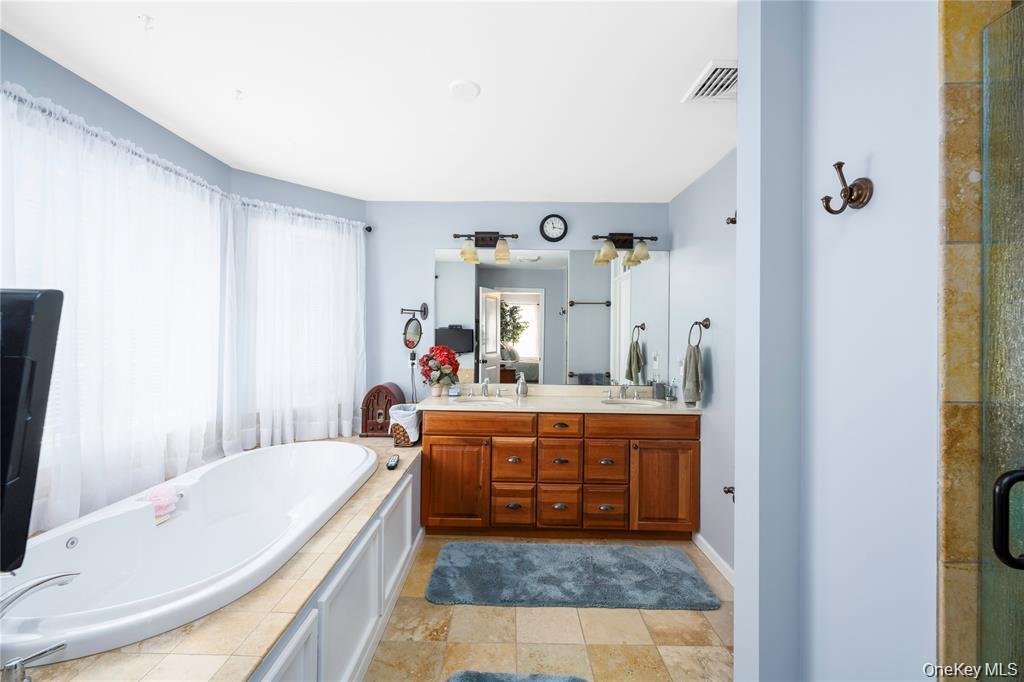 6 Old Town Road Beacon, NY 12508 - Photo 26 of 49 a large bathroom with a tub sink and mirror