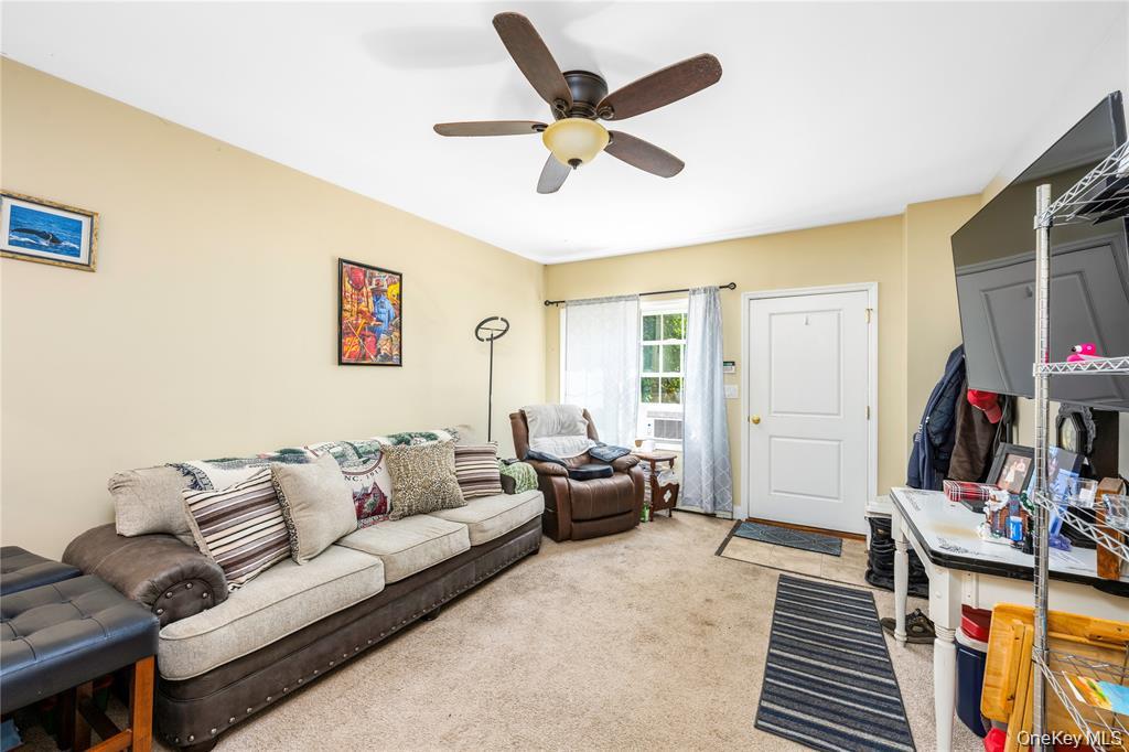 6 Old Town Road Beacon, NY 12508 - Photo 37 of 49 a living room with furniture and a flat screen tv