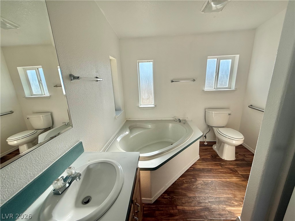 6450 Vicki Ann Road Pahrump, NV 89048 - Photo 7 of 9 Indulge in a tranquil bathing experience with this deep soaking tub and stylish vanity.