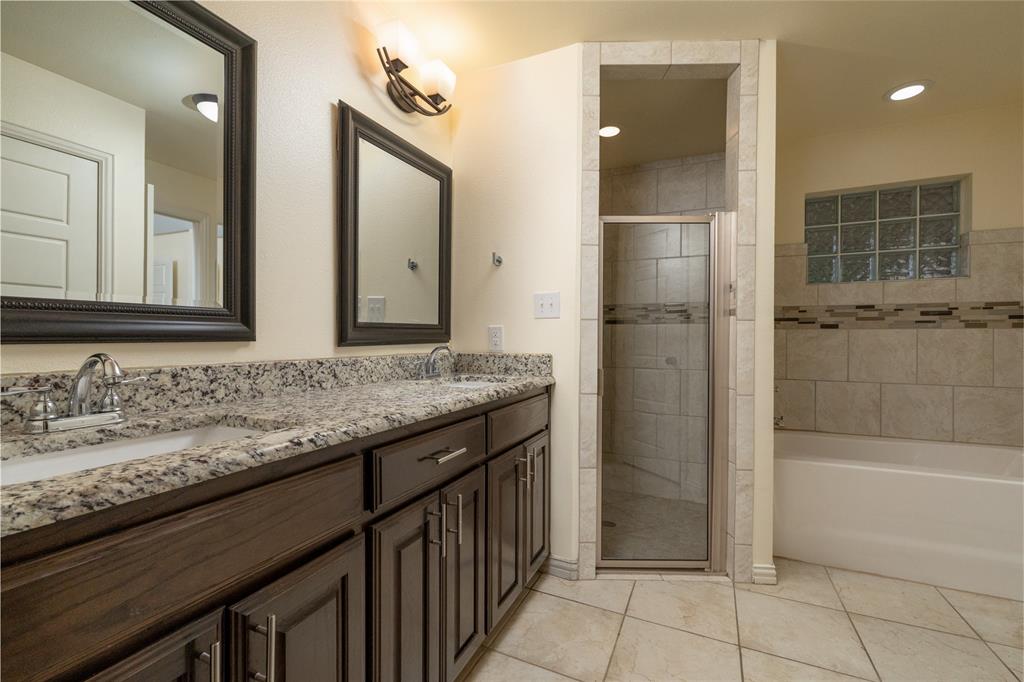405 Kimbrough Road Azle, TX 76020 - Photo 20 of 39 a bathroom with a granite countertop sink and a mirror