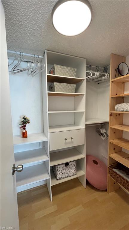 267 Quail Forest Boulevard, Unit 111 Naples, FL 34105 - Photo 21 of 41 a view of walk in closet with empty racks