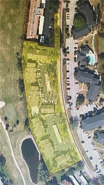 267 Quail Forest Boulevard, Unit 111 Naples, FL 34105 - Photo 40 of 41 a bathroom with a granite countertop sink and a mirror