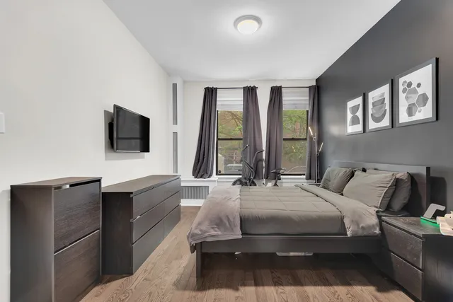a bathroom with a sink mirror and a shower