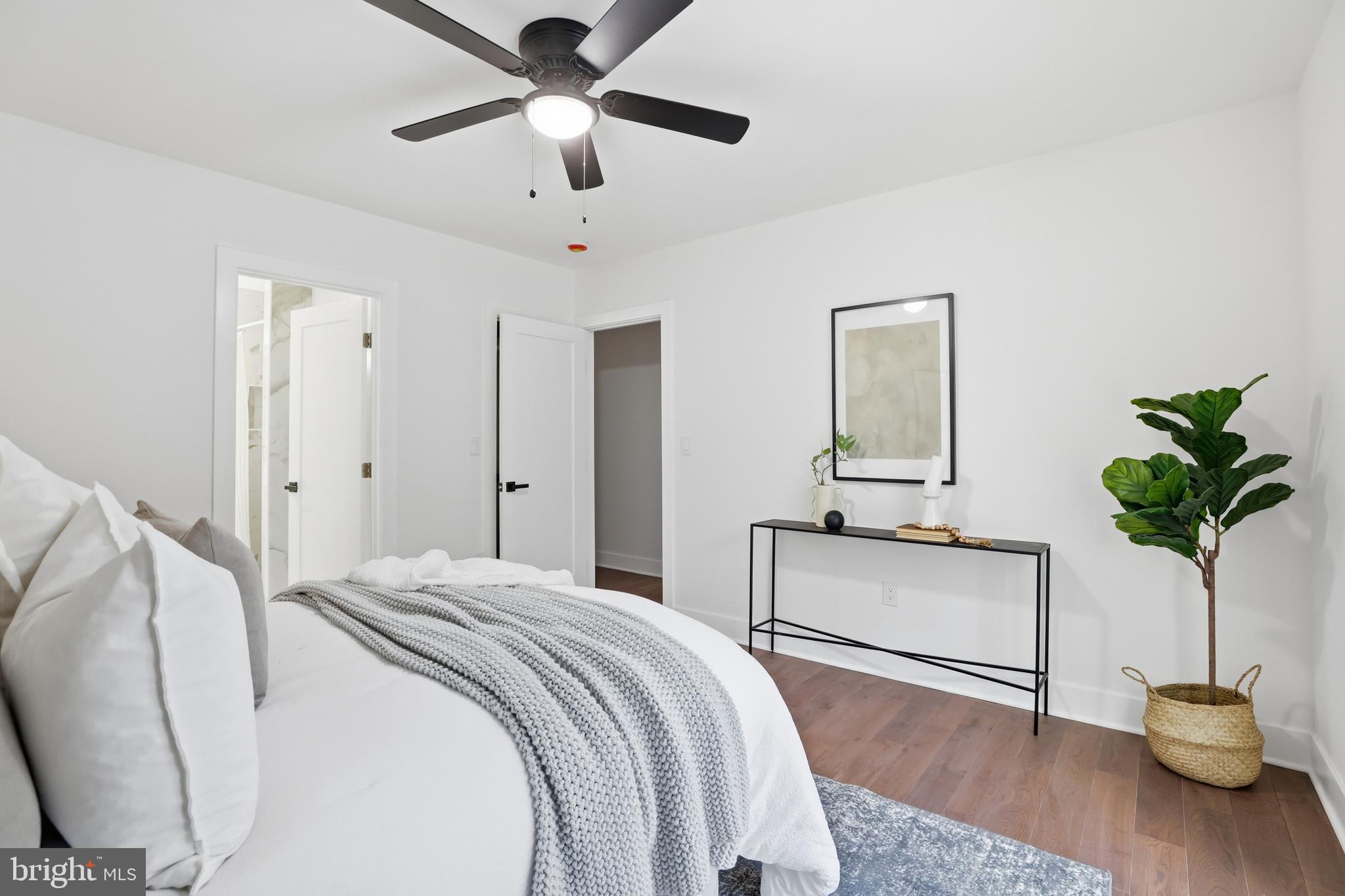413 Williamsburg Drive Silver Spring, MD 20901 - Photo 17 of 33 a bedroom with a bed and a potted plant