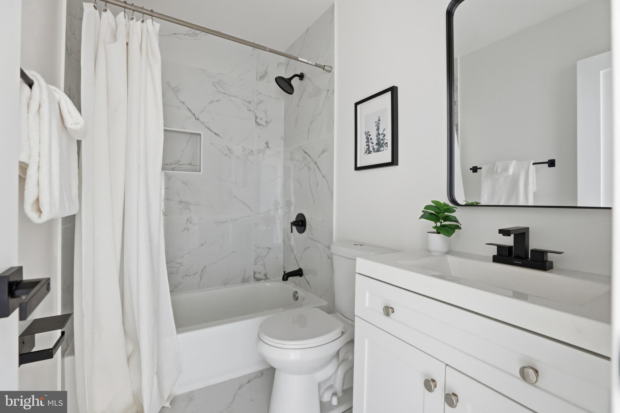 413 Williamsburg Drive Silver Spring, MD 20901 - Photo 18 of 33 a bathroom with a sink a toilet and shower