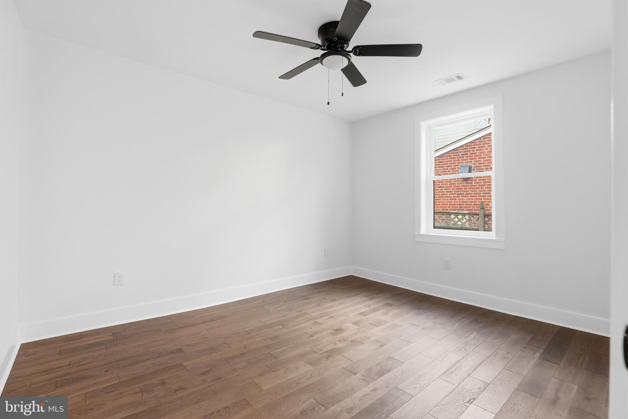 413 Williamsburg Drive Silver Spring, MD 20901 - Photo 22 of 33 wooden floor in an empty room