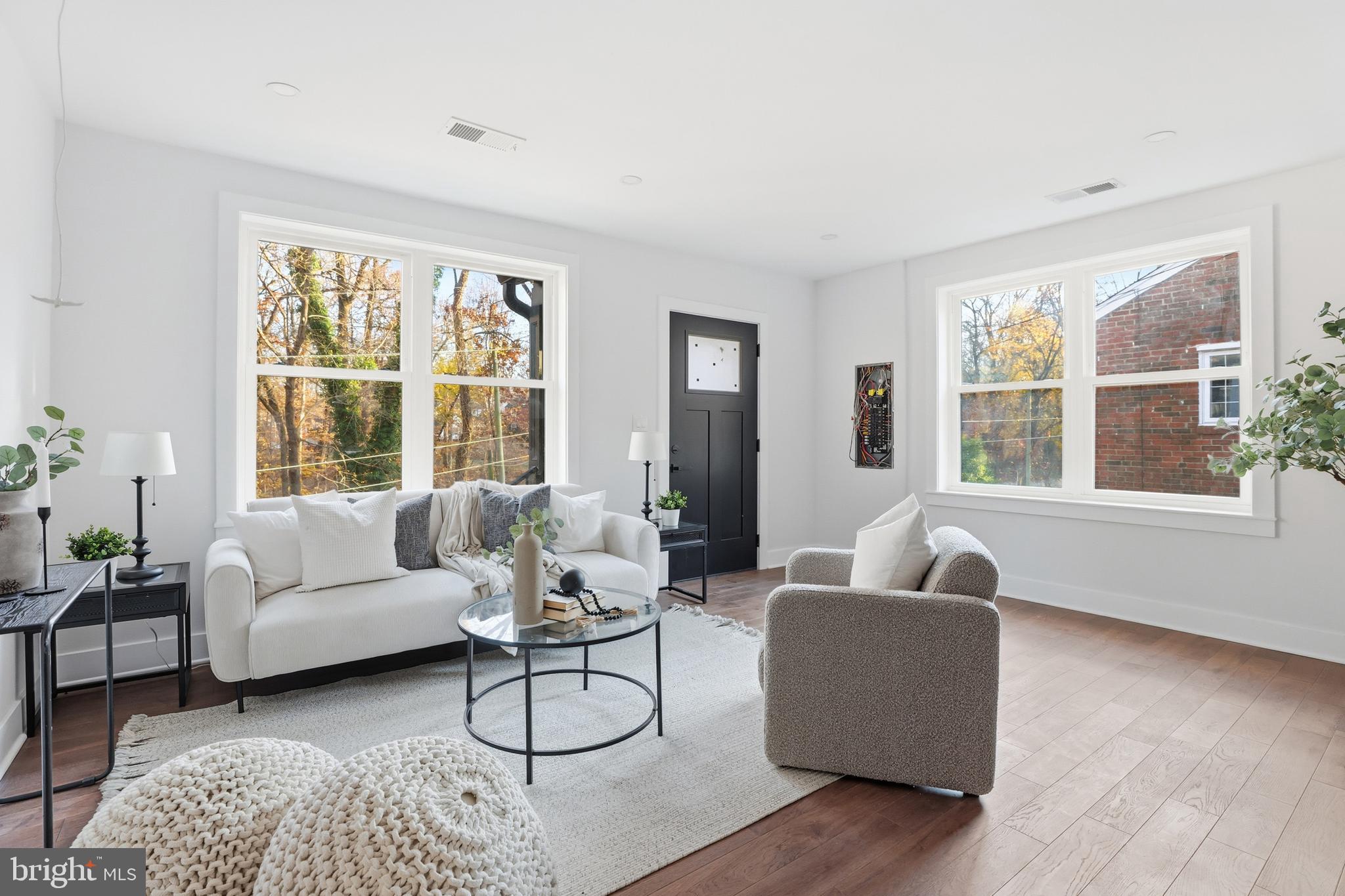 413 Williamsburg Drive Silver Spring, MD 20901 - Photo 7 of 33 a living room with furniture and floor to ceiling windows