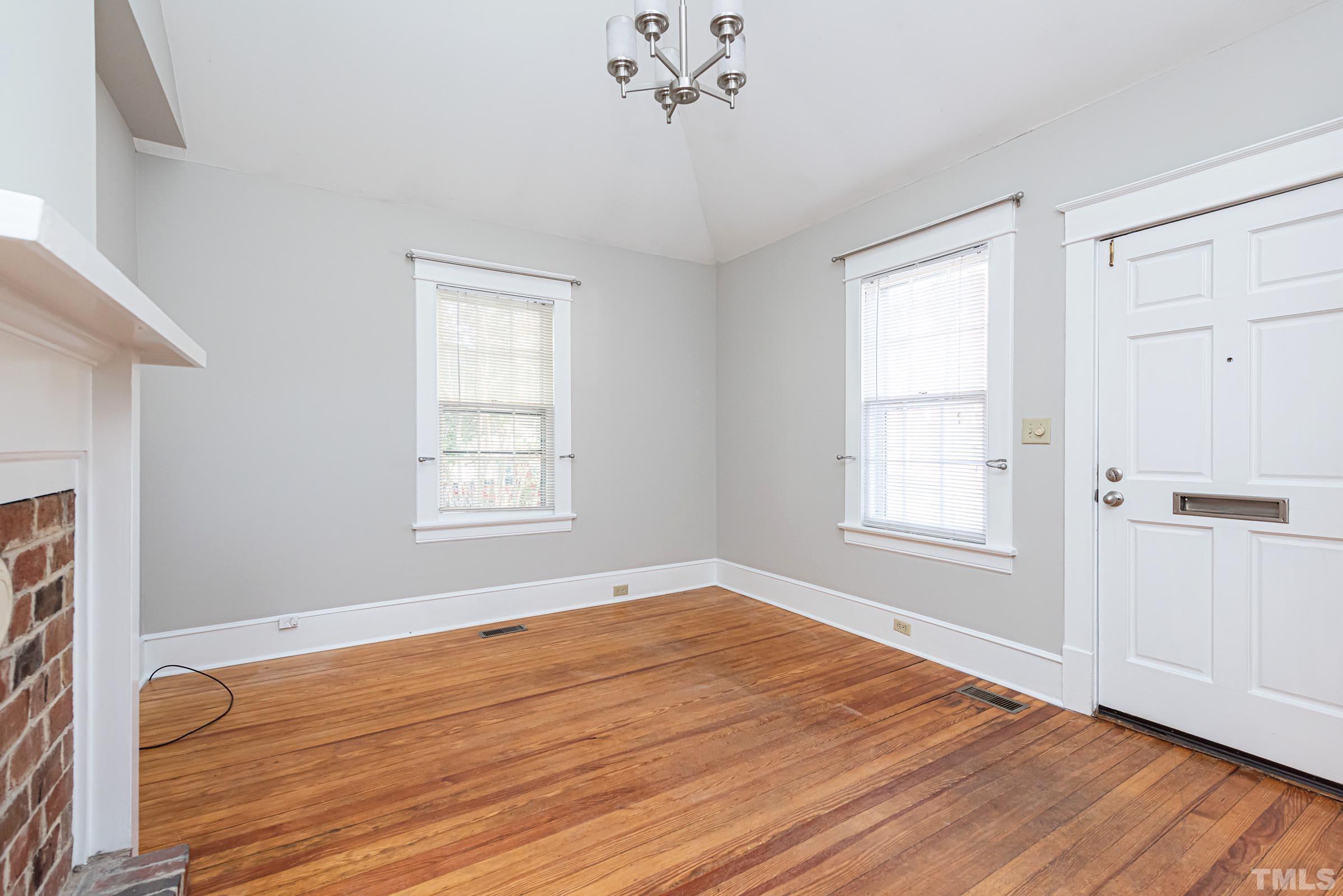 619 Hinsdale Street Raleigh, NC 27605 - Photo 2 of 34 a view of empty room with wooden floor and fan