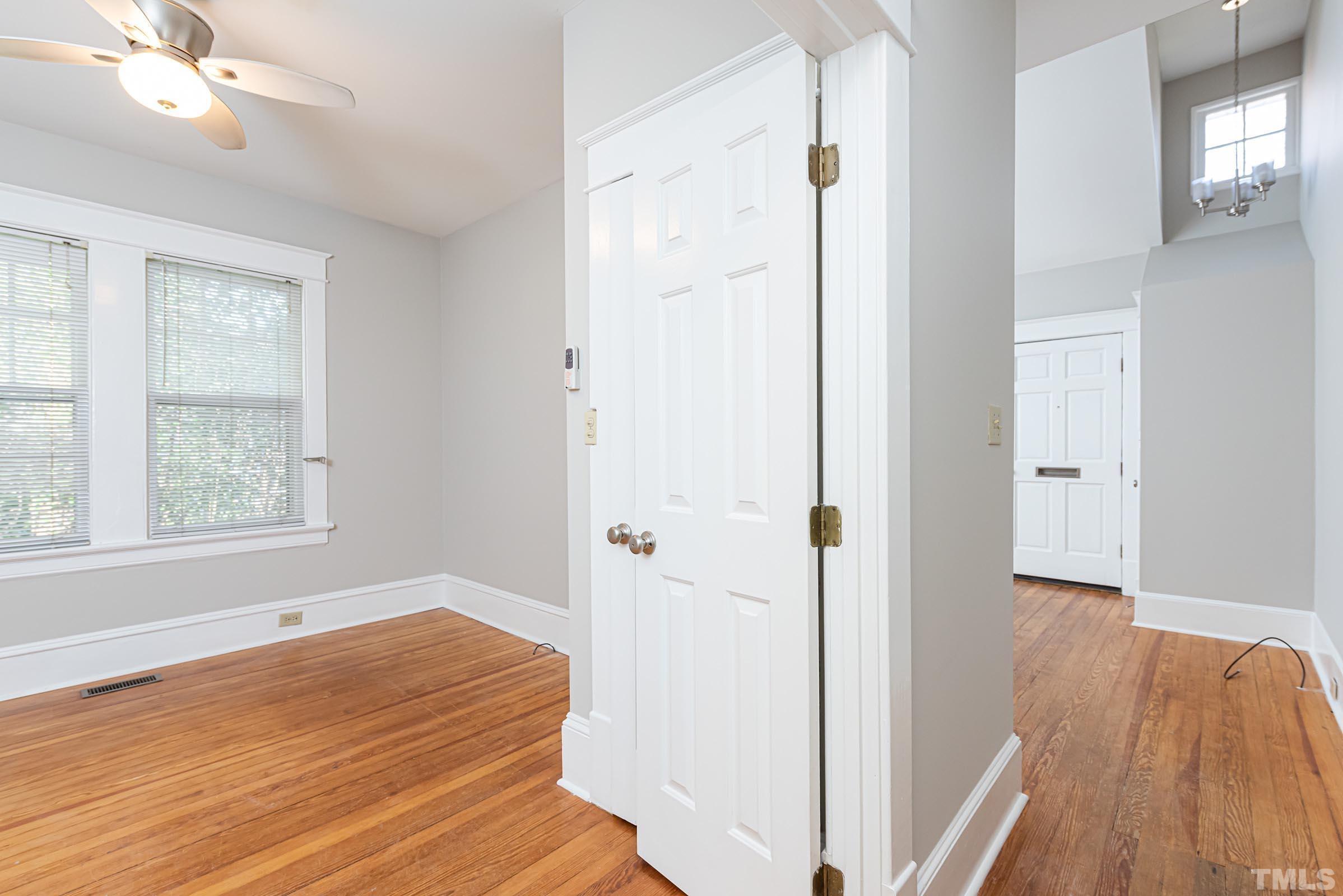 619 Hinsdale Street Raleigh, NC 27605 - Photo 5 of 34 wooden floor in an empty room with a window