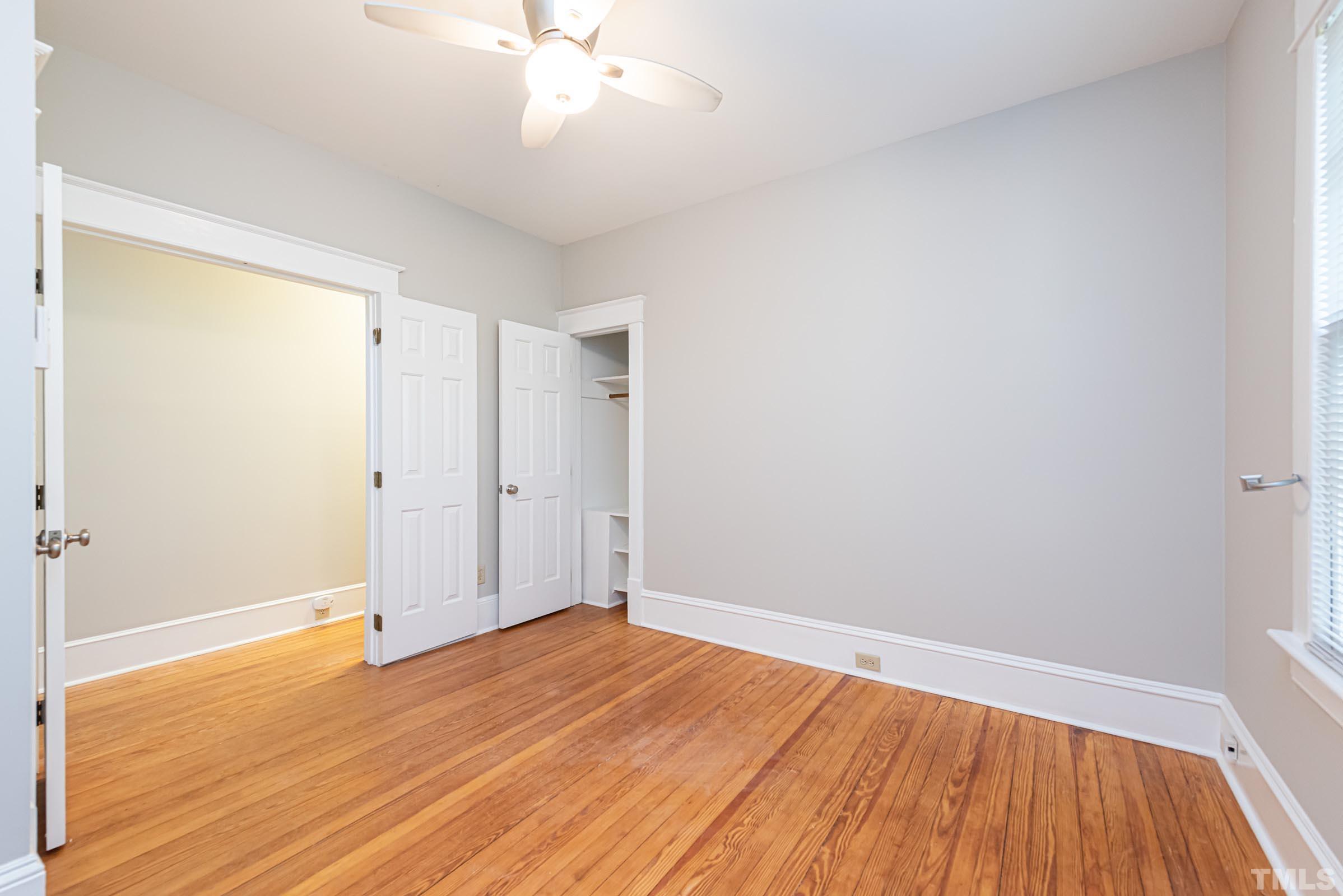 619 Hinsdale Street Raleigh, NC 27605 - Photo 7 of 34 a view of an empty room with wooden floor