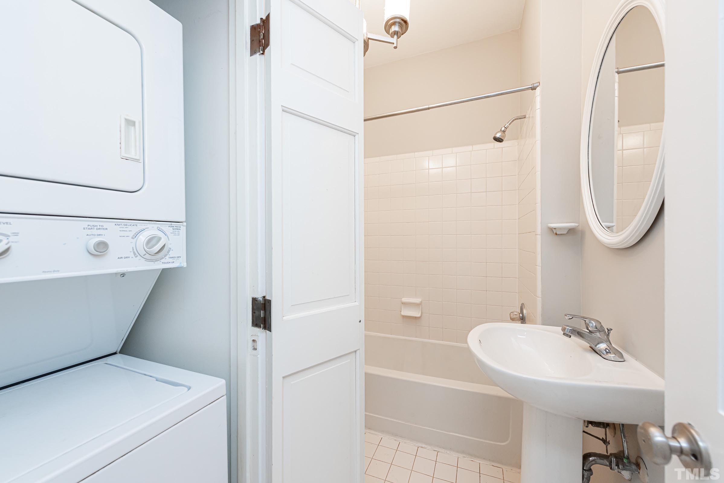 619 Hinsdale Street Raleigh, NC 27605 - Photo 9 of 34 a bathroom with a sink a toilet and shower