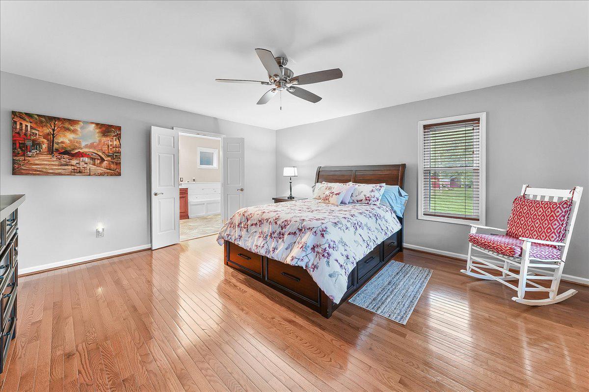 51 Ridings Way Chadds Ford, PA 19317 - Photo 37 of 57 Serene primary bedroom with warm wood tones.