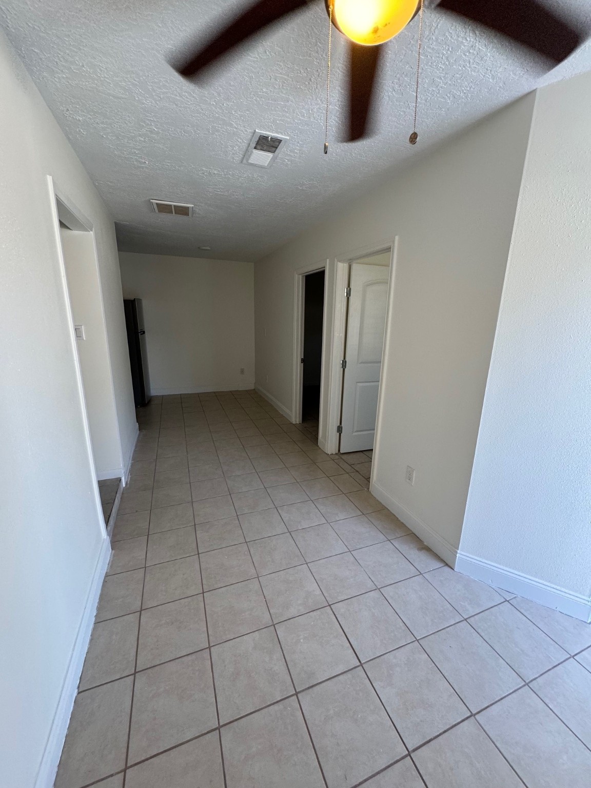 10134 Kirkglen Drive, Unit 3 Houston, TX 77089 - Photo 2 of 8 a view of an empty room with a window