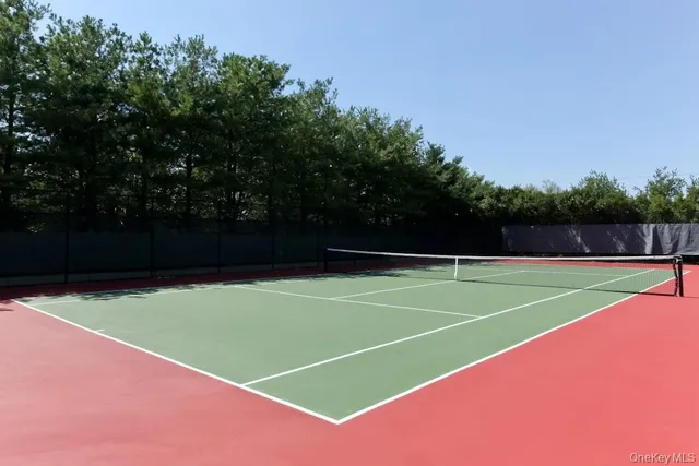 a view of an outdoor space and tennis court