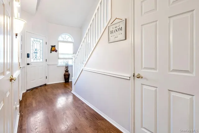 a view of entryway with wooden floor