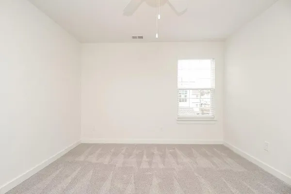 a bathroom with a shower sink and vanity