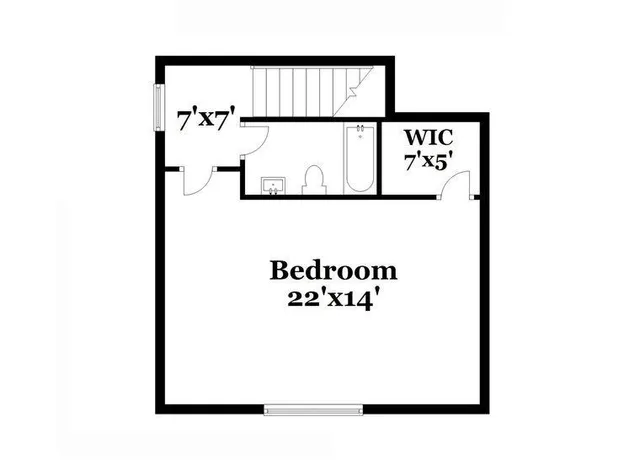 an empty room with wooden floor and window