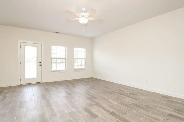 a view of an empty room with a window