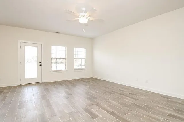 a view of an empty room with a window