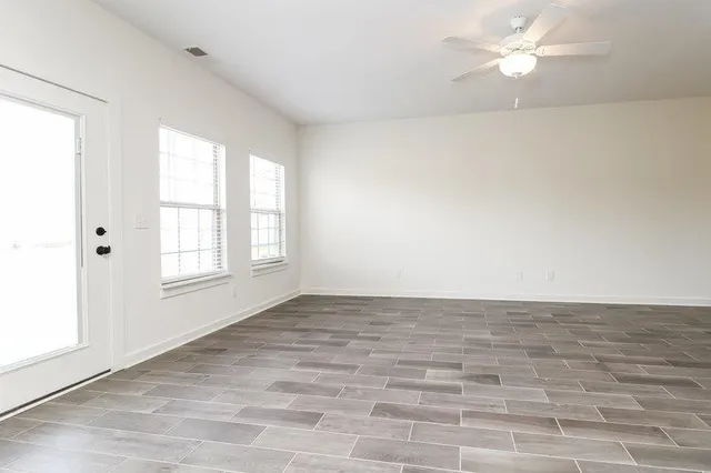 a view of a kitchen with a sink and dishwasher wooden floor