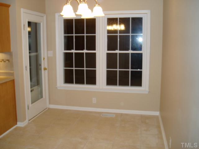 7309 Shawan Road Wendell, NC 27591 - Photo 6 of 12 Dining room with 3rd entry door to the back yard and patio.