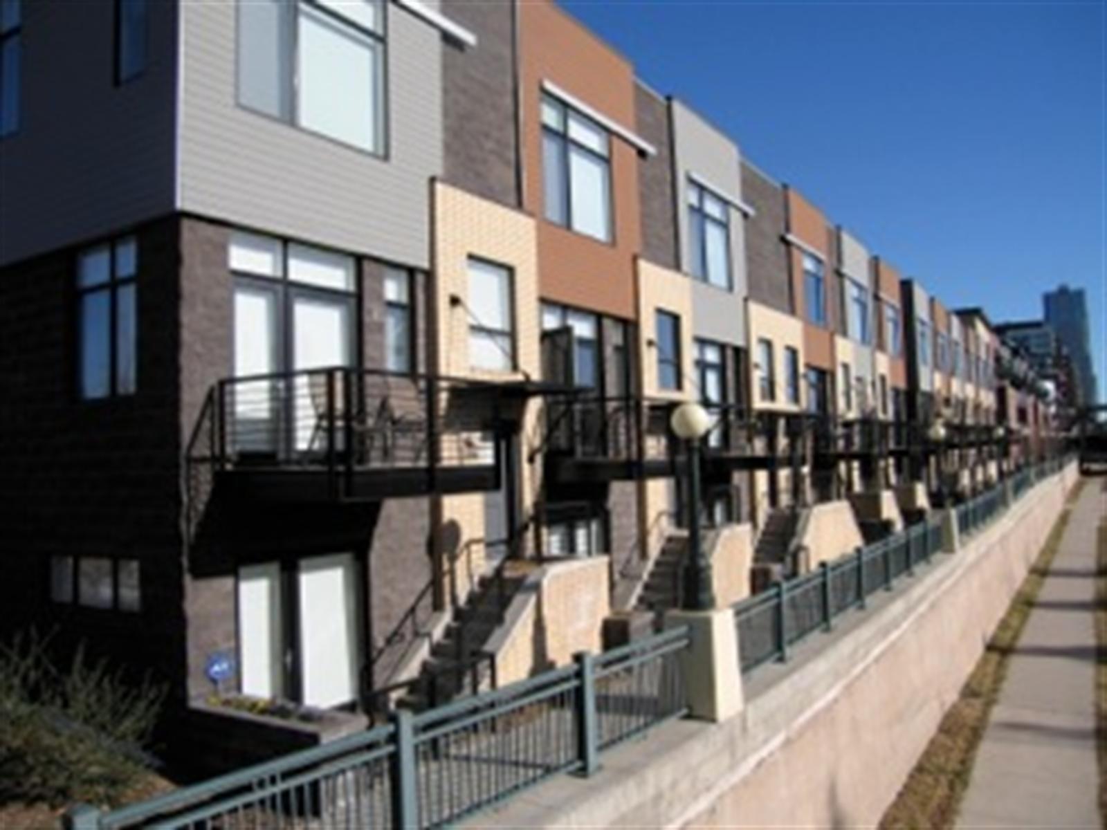 a view of a brick building with many windows