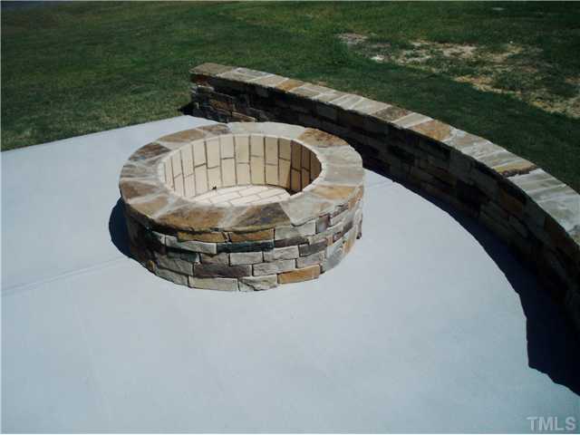 6100 Spring Branch Circle, Unit 42 Raleigh, NC 27603 - Photo 12 of 13 Backyard patio and fire pit for a great evening with family and friends.